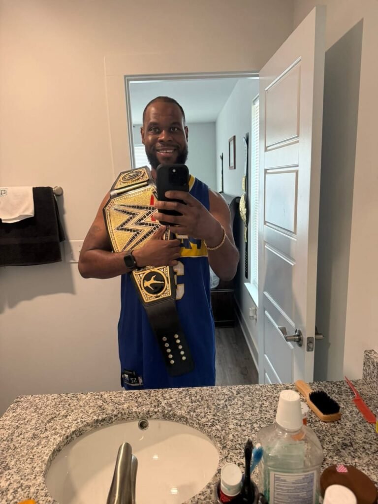 a man from the USA weighted the WWE championship belt on his shoulder