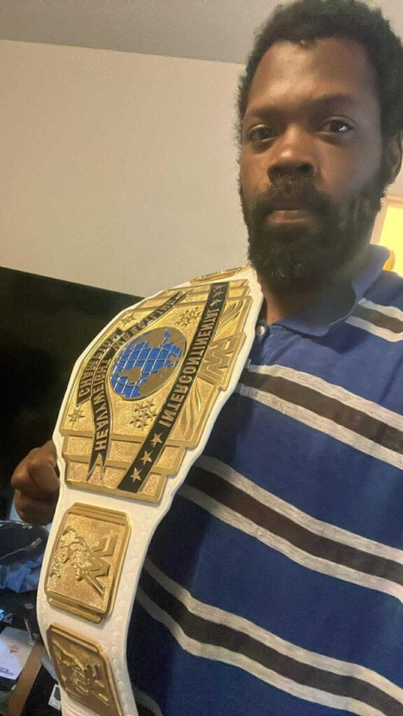 WWF winged eagle belt on the shoulder of the black man